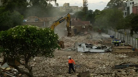 Clearing debris and rubble after homes demolished in Sydney 6K Stock Footage 325774976
