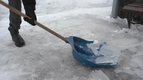 Clearing ice near building Stock-Footage 327896986
