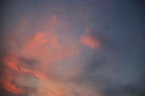 Clearing of the last cloud. small clouds blown away by wind at sunset time. P Stock Photos