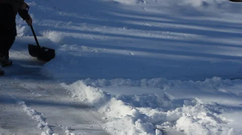 Clearing the pond by shoveling the snow. Stock Footage 34335645