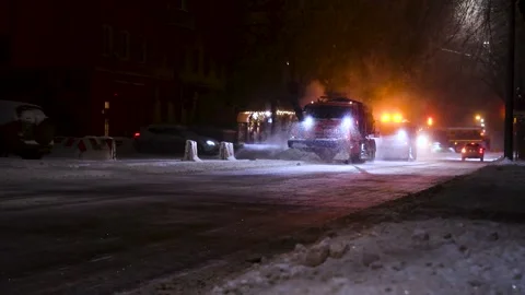 Clearing roads during a winter snowstorm Stock Footage 320997063
