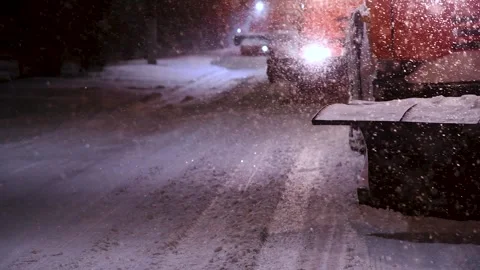 Clearing roads during a winter snowstorm Stock Footage 320998207