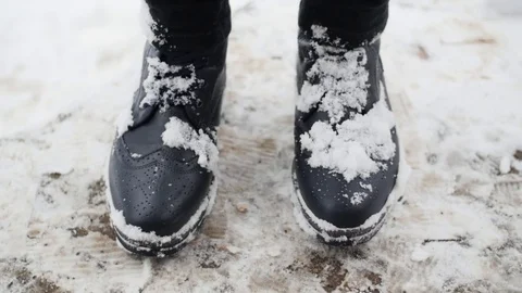 Clearing Snow Off Of Boots In Slow Motion Stock Footage 85103959