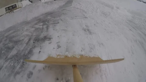 Clearing snow from the pavement Stock Footage 126054911