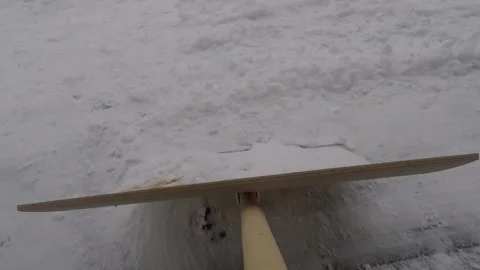 Clearing snow from the pavement Stock Footage 146133047