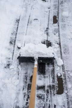 Clearing snow from the sidewalk Stock Photos