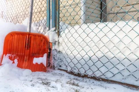 Clearing snow from the surrounding area. Stock Photos