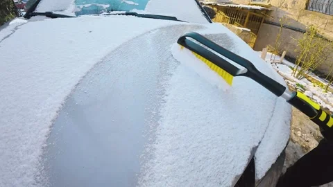 Clearing Snow From Vehicle Hood Using Snow Brush, Slow Motion Stock Footage 327077563