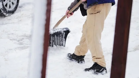 Clearing Snow In Winter With A Shovel Stockbeeldmateriaal 85098816