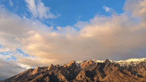 Clearing storm and beautiful clouds drift over the Rocky Mountains in Utah Stock Footage 128466834