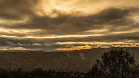Clearing Storm Clouds above Austere Foothill Landscape Time Lapse Stock Footage 279642661