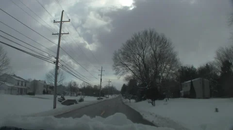 Clearing windshield with snow while driving Stock Footage 1052943