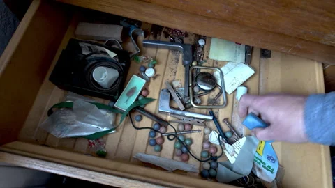Clearing Years of Clutter from Drawer During Major Home Decluttering Video stock 337763672
