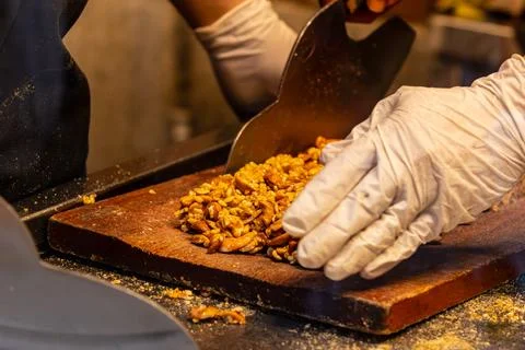 Cleaver and Gloves During Peanut Candy Making Stock Photos