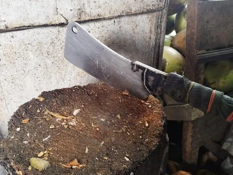 A cleaver stuck in a tree trunk Stock Photos