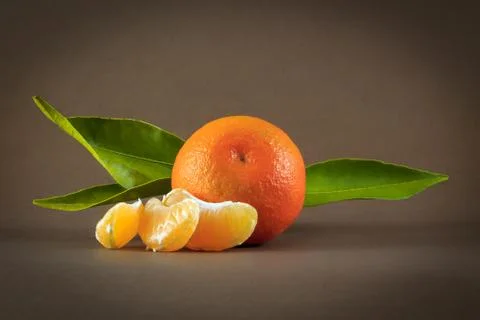Clementine on brown background Stock Photos