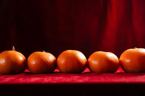 Clementines on red background Stock Photos