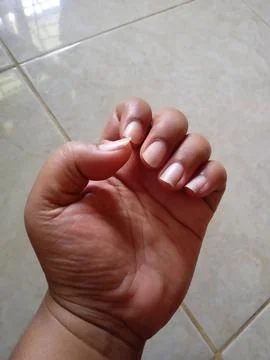 Clenched hands Stock Photos