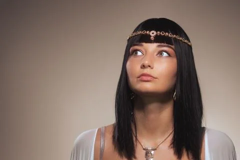 Cleopatra-Inspired Model With Surprised Expression and Traditional Jewelry Stock Photos