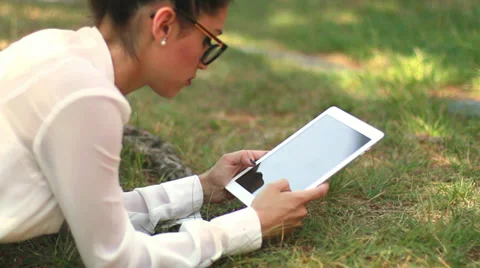 Clerk with iPad tablet computer in the park 01 Stock Footage 39570509