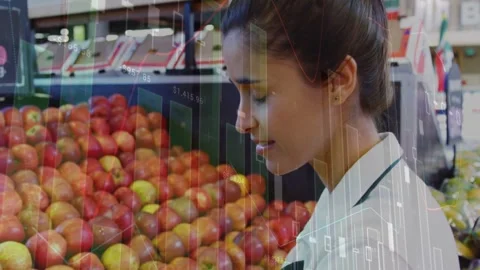 Clerk leaning, checking, tidying apples in store with data bars overlaying, Stock Footage 333396617