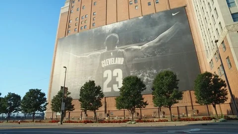 CLEVELAND, DOWNTOWN,  LARGE LEBRON JAMES MURAL, WITH TREES Stock Footage