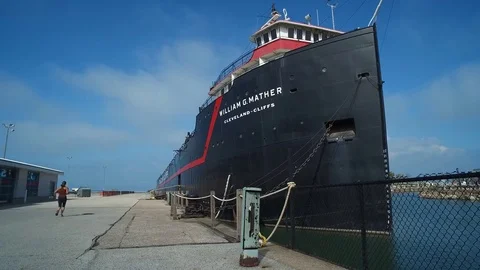 CLEVELAND, SHIP MUSEUM, FRONT DOCK VIEW, WOMAN JOGS BY Stock Footage 70087113