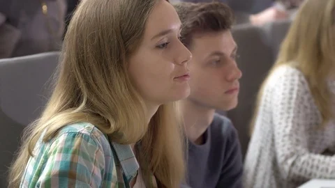 Clever attractive student asking a question in the lecture Stock Footage 69926781