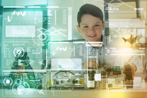Clever child feeling glad while showing his amazing inventions Foto stock