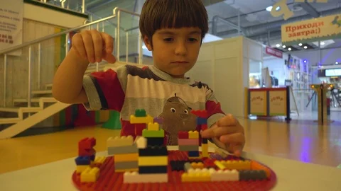 Clever child plays with building blocks Stock Footage 92219652