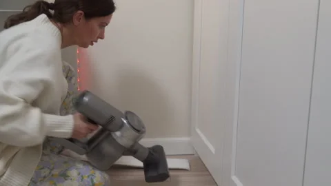 Clever Cleaning Solution: Microfiber Roller Reaches Narrow Gap Behind Furniture. Stock Footage 321151254