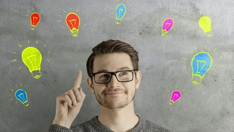 Clever creative man think gets an idea, which jumps up as symbolic colored Stock Footage 74470484