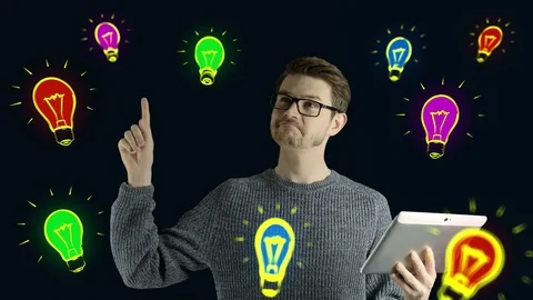 Clever hipster creative man think touch digital tablet ipad gets an idea, which Stock Footage 74577855