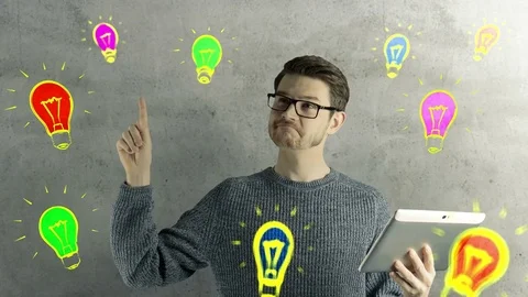 Clever hipster creative man think touch digital tablet ipad gets an idea, which Stock Footage 74578304