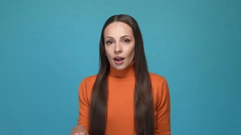 Clever lady touch chin hand choose solution isolated blue color background 動画素材 167652183
