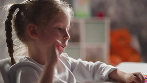 Clever little girl counts elements on table at mental maths Video stock 171670542