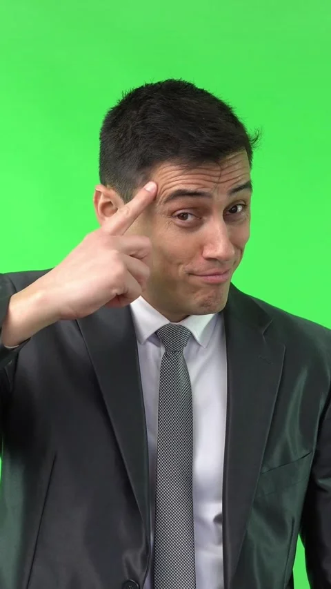 Clever man in suit pointing to head 動画素材 244743836