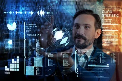 Clever programmer admiring the options of his futuristic screen Stock Photos
