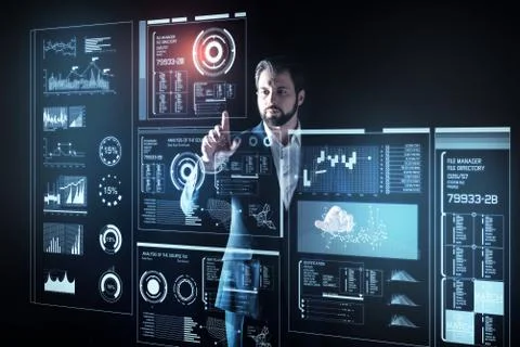 Clever programmer touching the screen while working alone Stock Photos