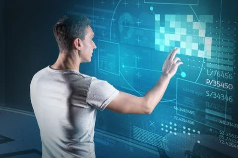 Clever web developer looking interested while working in his office Stock Photos