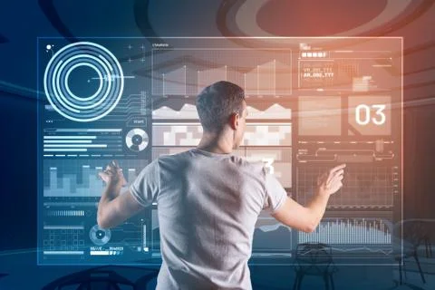Clever web developer touching the transparent screen while working Stockfoto's