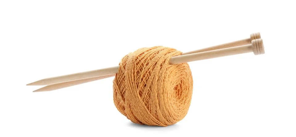 Clew of colorful thread with knitting pins on white background Stock Photos