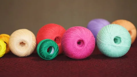 Clews of natural wool on table. Yarn for knitting. Skeins of yarn 動画素材 109182160
