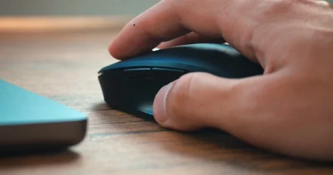 Click black computer mouse on a work desk. Working with a PC or laptop at Stock-Footage 224114152