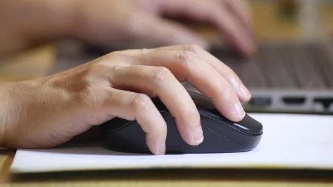 Click black computer mouse on a work desk. Working with a PC or laptop at w.. Stock Footage 254139540
