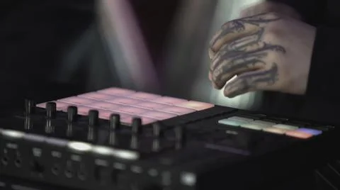 Click colored squares on mixer panel. ART. Hands in dark room are dialing code 写真素材