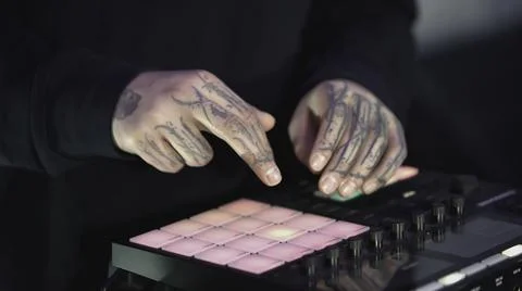 Click colored squares on mixer panel. ART. Hands in dark room are dialing code 写真素材