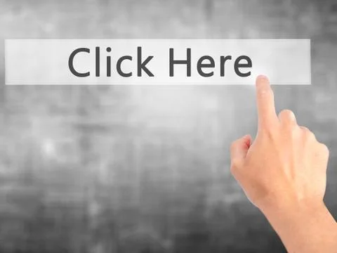 Click Here - Hand pressing a button on blurred background concept on visual s Stock Photos