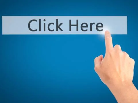 Click Here - Hand pressing a button on blurred background concept on visual s Stock Photos