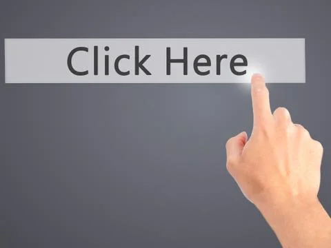 Click Here - Hand pressing a button on blurred background concept on visual s Stock Photos